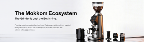 THE MOKKOM ECOSYSTEM The Grinder is Just the Beginning. Precision brewing requires the right tools. Equip your machine with our curated ecosystem—from distribution to dosing—to eliminate variables and achieve a flawless workflow.